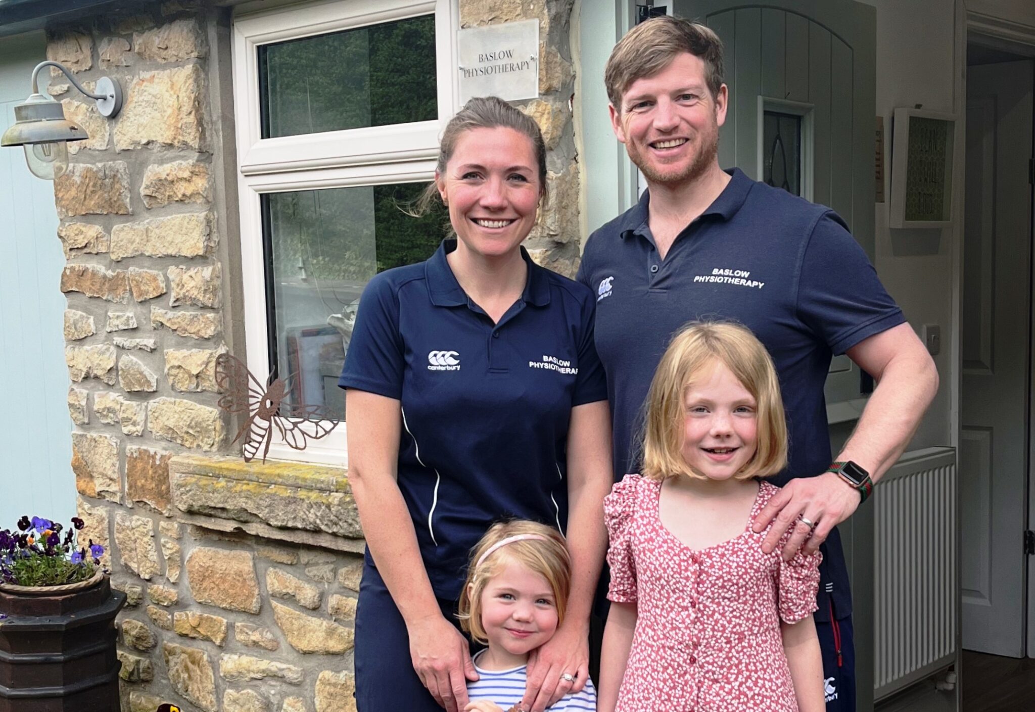 Sarah Titman & Guy Titman with their children outside Baslow Physiotherapy