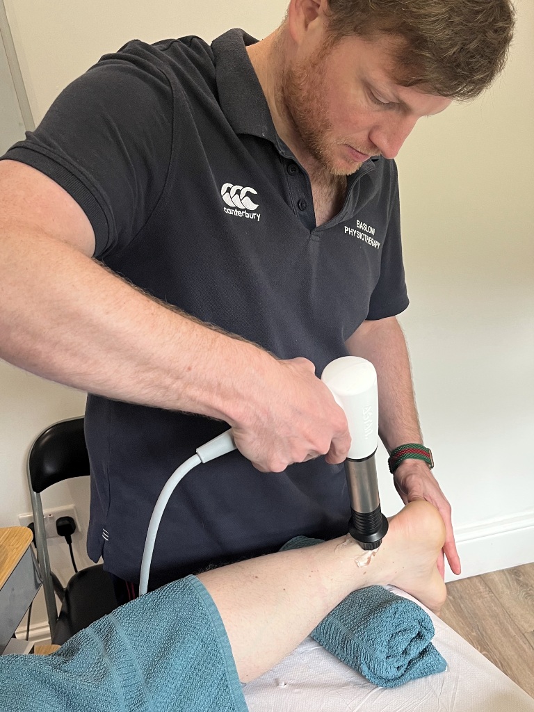 Guy Titman of Baslow Physiotherapy working with a patient