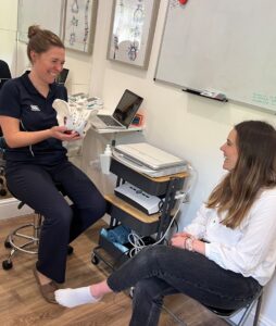 Sarah Titman of Baslow Physiotherapy discussing pelvic floor problems with a patient, pelvic pain physiotherapy