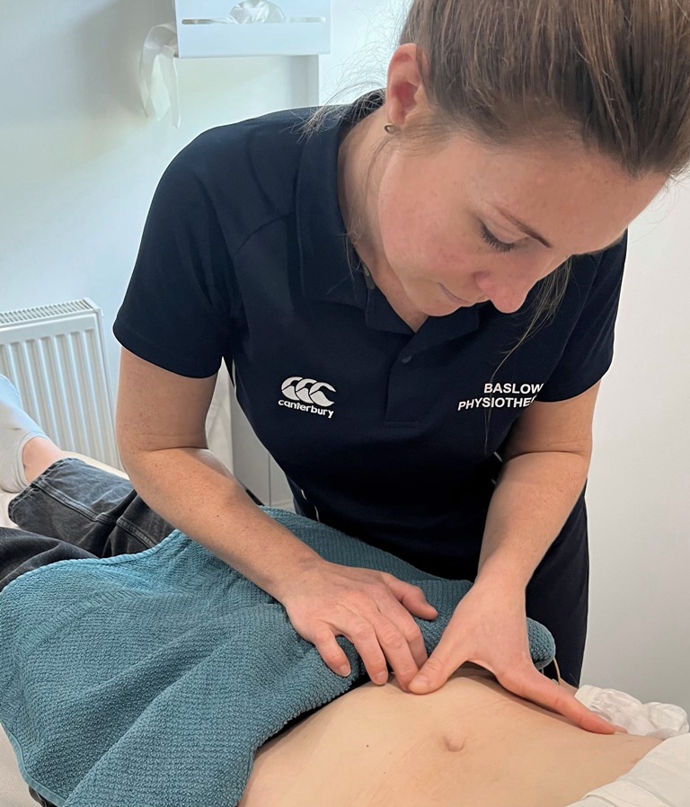 Sarah Titman of Baslow Physiotherapy examining a patient, scar massage physiotherapy