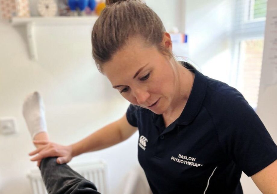 Sarah Titman of Baslow Physiotherapy examining a patient