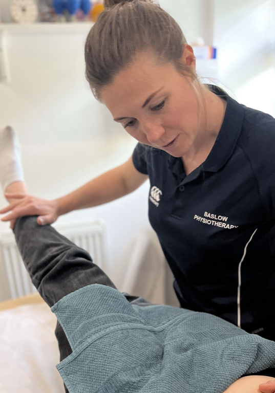 Sarah Titman of Baslow Physiotherapy examining a patient, physiotherapy for joint pain