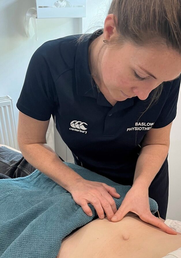 Sarah Titman of Baslow Physiotherapy examining a patient, scar massage physiotherapy